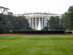 The White House from the South Lawn showing the columned South Portico. The South Portico was constructed in 1829 based on earlier drawings by James Hoban. The second floor balcony, known as the Truman Balcony, was added in 1947. Welcome ceremonies for visiting heads of state take place on the South Lawn. Marine One, the president's helicopter service, lands and departs from the South Lawn.