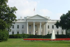 North façade of the White House, seen from Pennsylvania Avenue. A visiting head of state enters the house for a state dinner through the North Portico. Tourists finish their tour by exiting through the North Portico. The house was originally built without porticos. Before construction of the north portico in 1824, the north façade looked much more similar to Leinster House shown in the picture immediately below. Both James Hoban–original architect of the White House, and Benjamin Henry Latrobe who developed plans for its rebuilding after the 1814 fire, proposed north and south porticos. Both porticos, as built, are the work of Hoban.